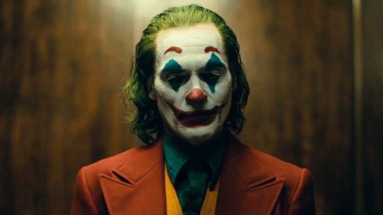 Joaquin Phoenix como Coringa Joaquin Phoenix como Coringa
